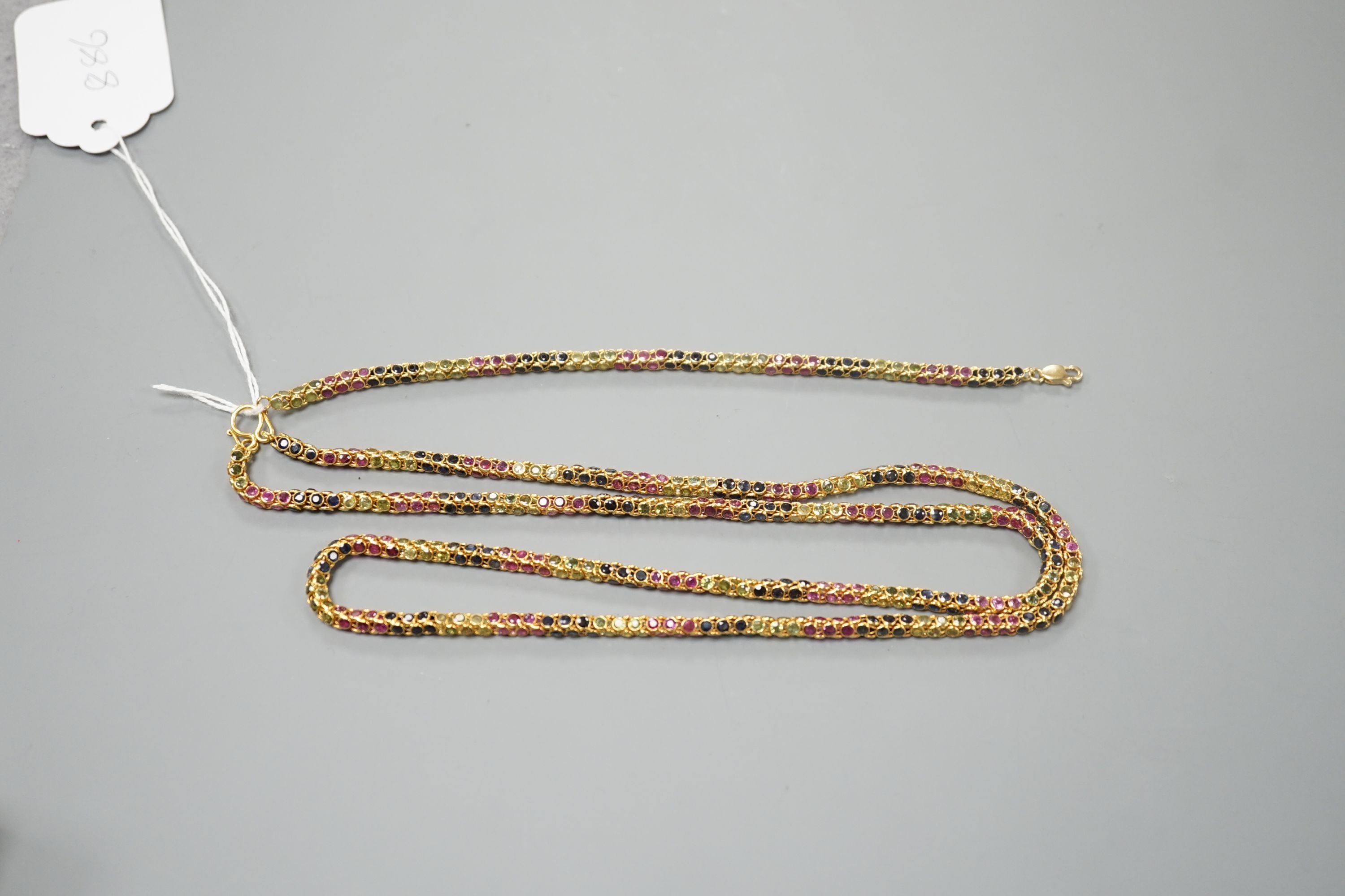 A modern Thai yellow metal and multi gem set necklace, 68cm and a similar bracelet stamped 585, 17.5cm, gross weight 35 grams.